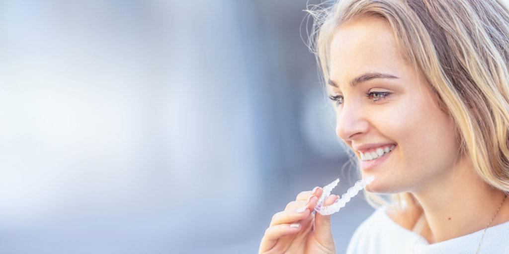 Dental Patient Putting Invisalign Aligner