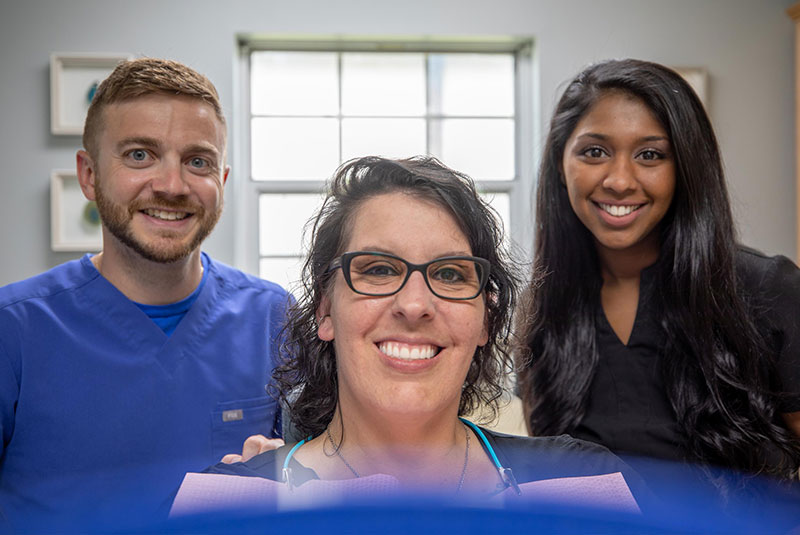 Patient Smiling With her Invisalign Straightened Teeth